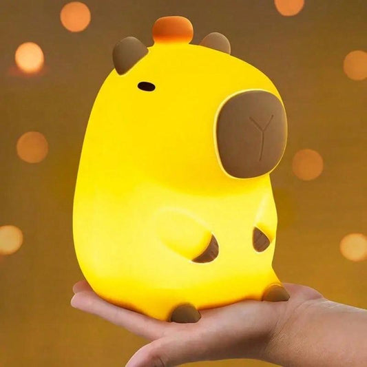 Capybara silicone night light glowing softly on bedside table | ARLOW