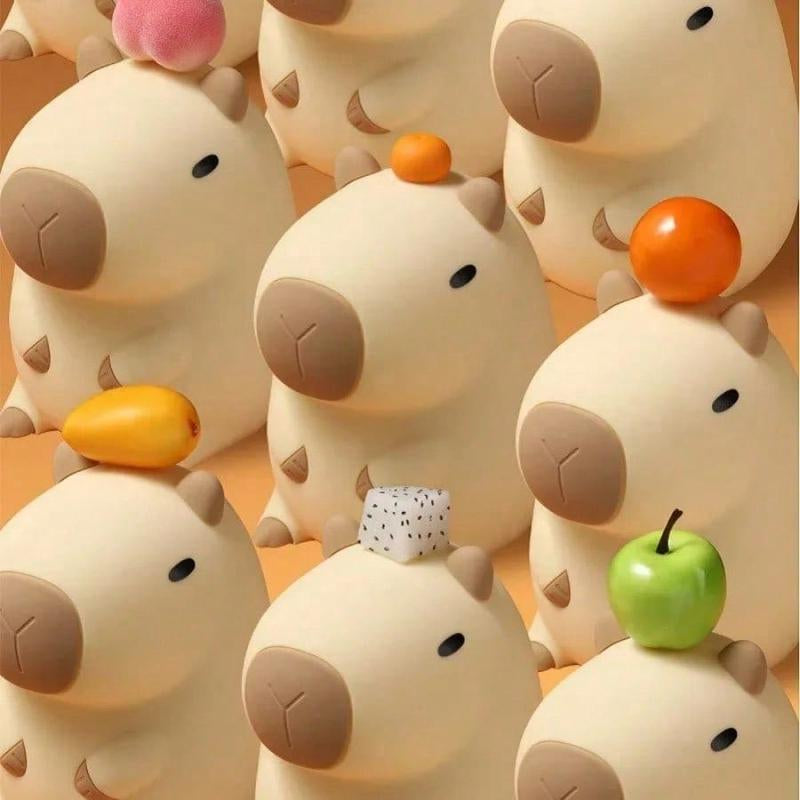 Soft-touch silicone capybara lamp in warm yellow glow | ARLOW